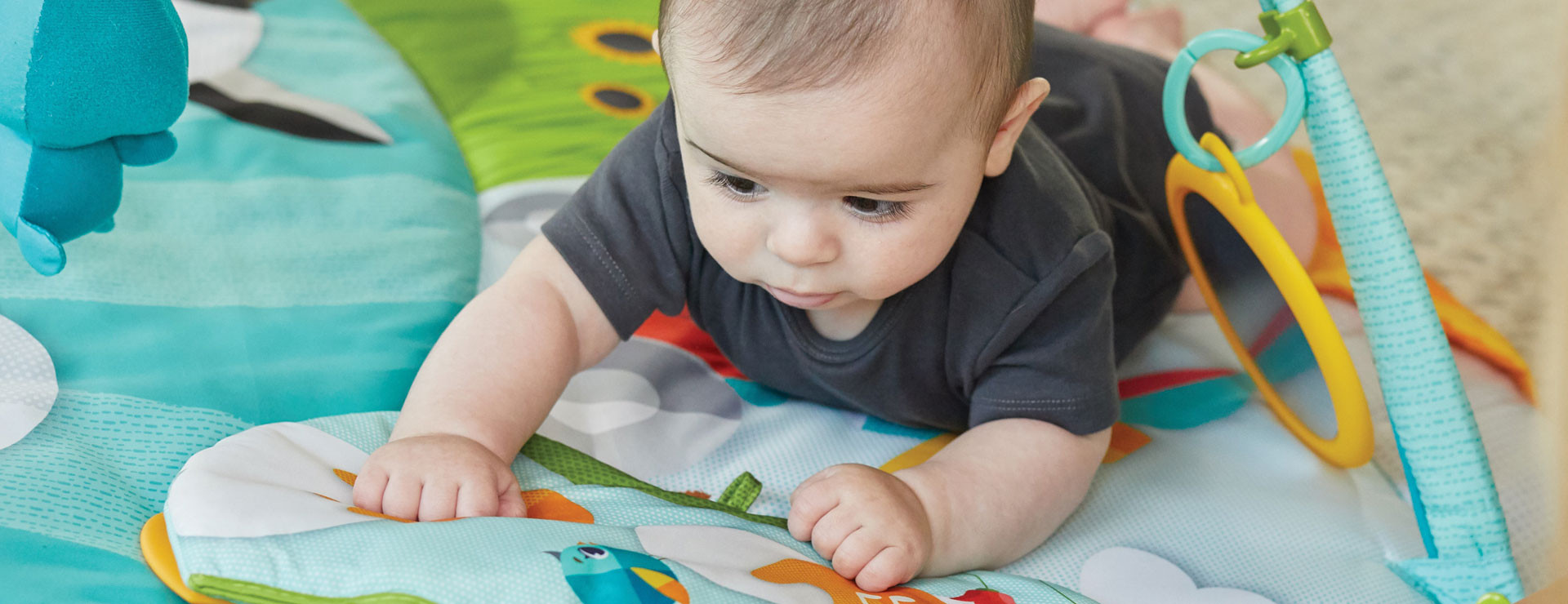 Baby -activated tapping pad for extended tummy time fun