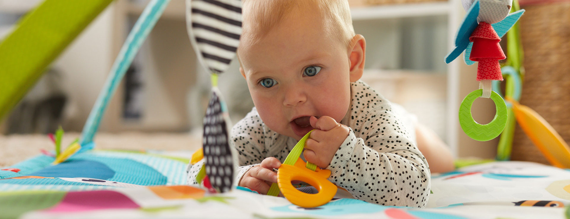 Geometric shaped toys and mat images stimulate baby’s vision